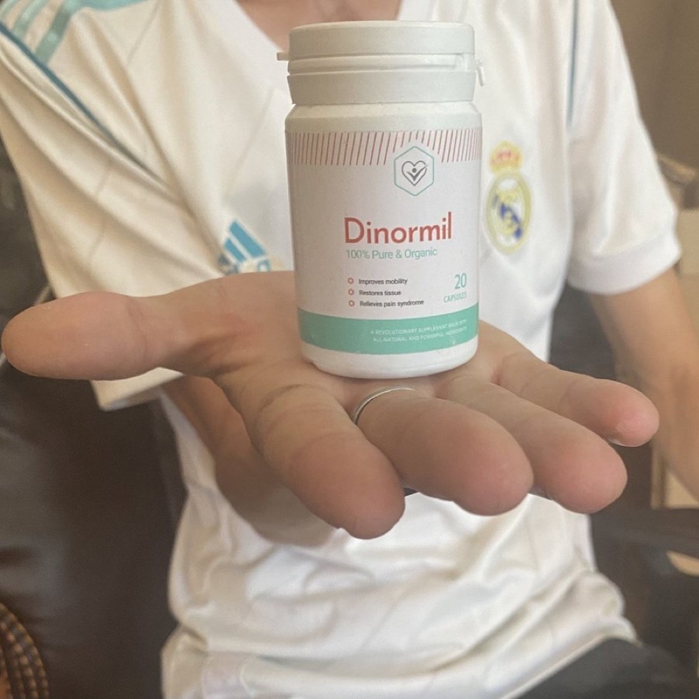 عبوة Dinormil البيضاء بشريط أخضر مع علبتها